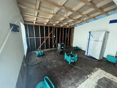 Opened walls and ceiling with air movers drying the framing in a Hayward room